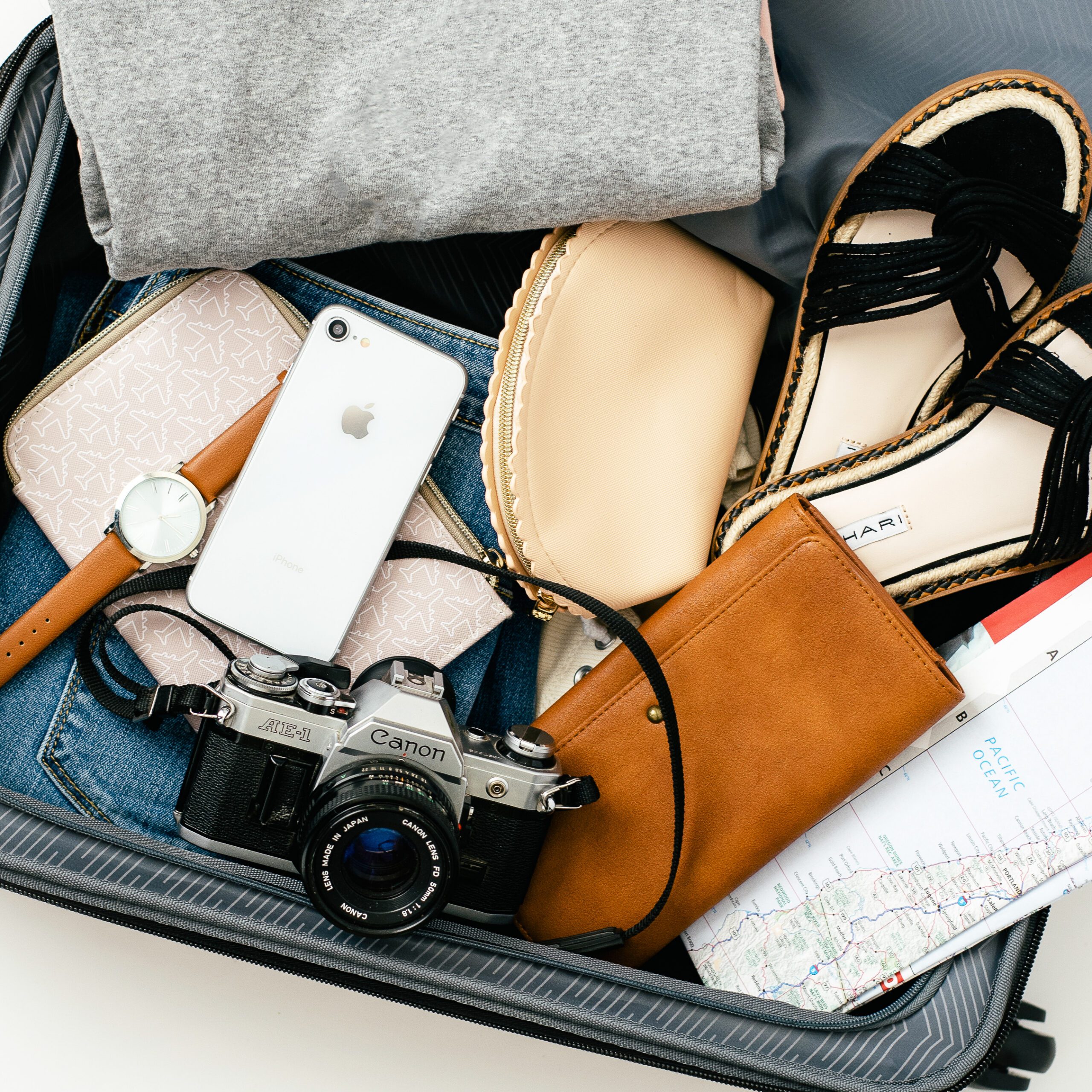 Stylish travel accessories including scarves, hats, jewelry and handbags, showcasing how to elevate outfits while packing light