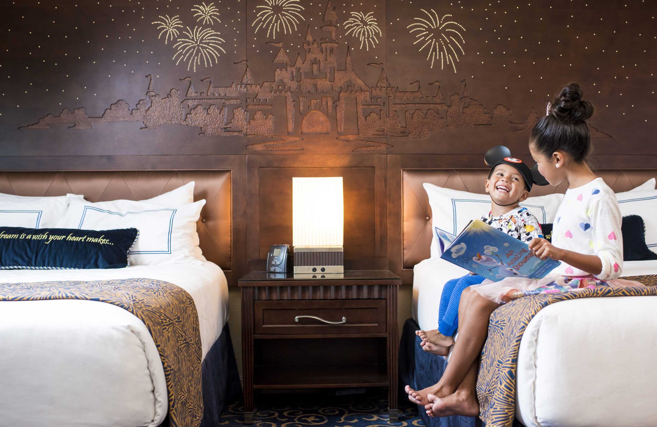 Spacious multi-generational hotel suites with connecting doors and theme park views.