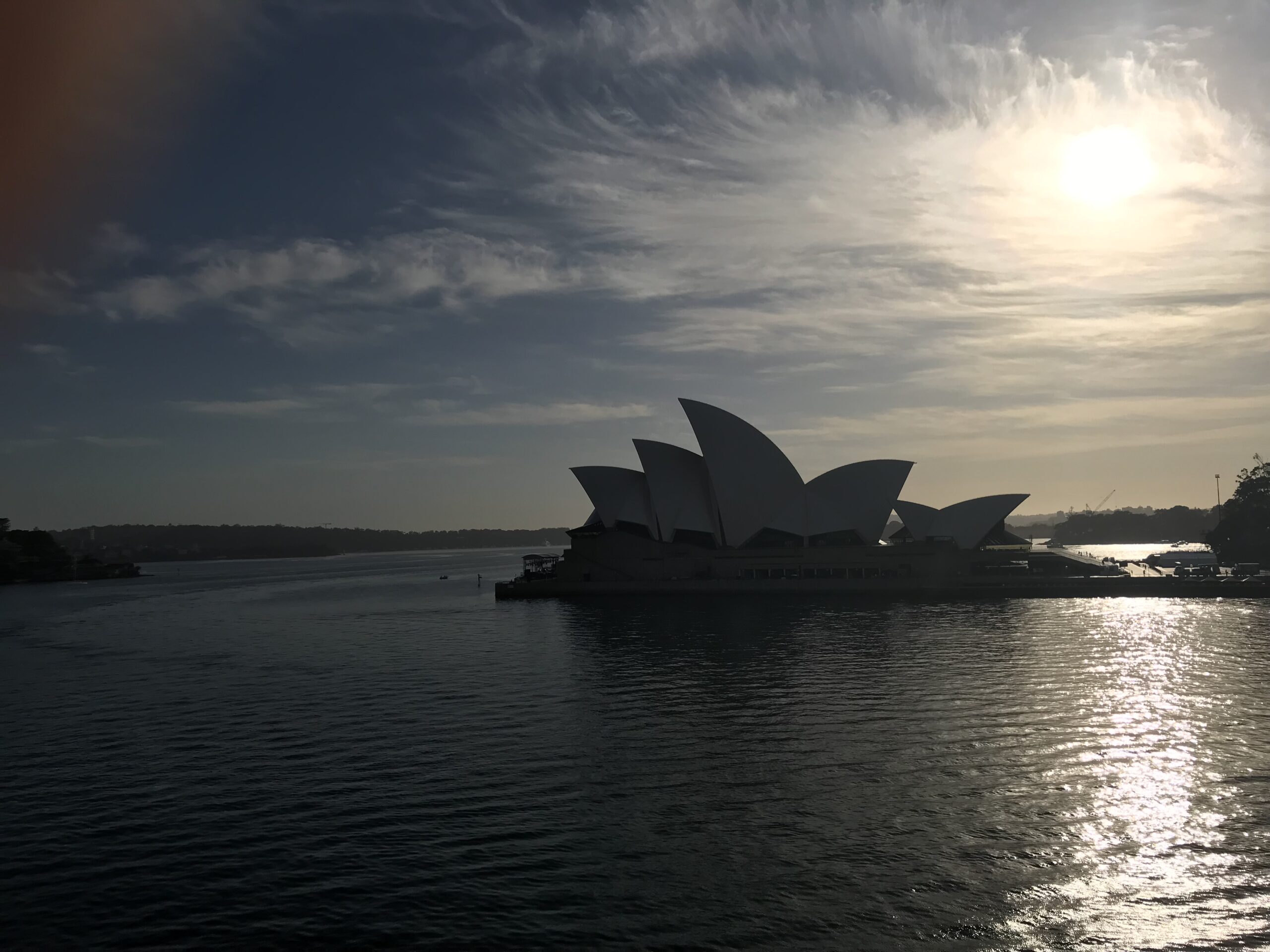 Sunrise view of the Sydney Opera House from an ocean cruise ship balcony