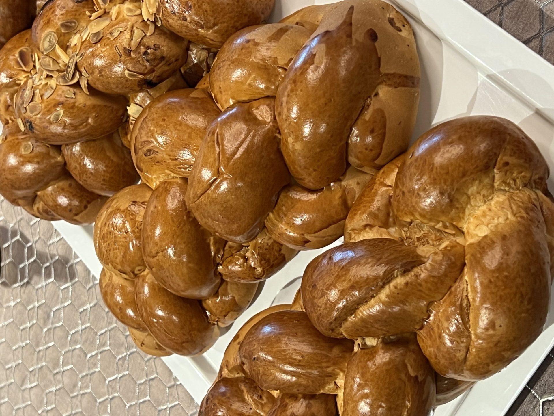 Display of braided bread and pastries in a traditional Vienna bakery